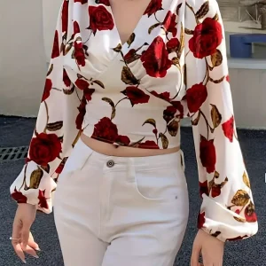 Gesneden blouse met V-hals en strik op de rug met rozenprint