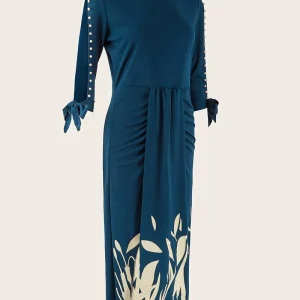 Elegante kralenjurk met mouwen