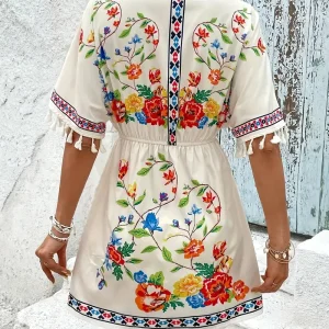 Elegante jurk met V-hals, korte mouwen en bloemenpatroon met kwastjes