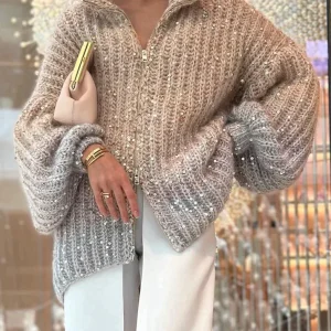 Selina - De elegante, glinsterende vesttrui met zijwaarts vest